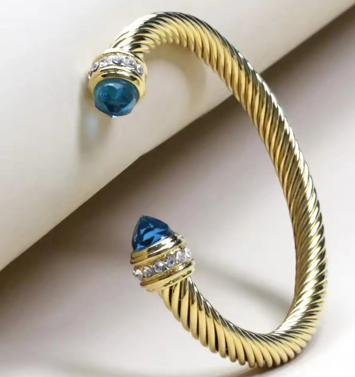 Cable Bracelet in Gold with Sapphire Blue Stone